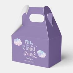 a purple box with clouds on it and the words, one cloud nine hundredth birthday