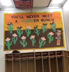 a bulletin board is hanging on the wall in front of bookshelves and shelves