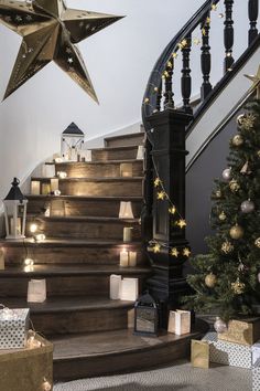 stairs decorated with christmas decorations and lit candles