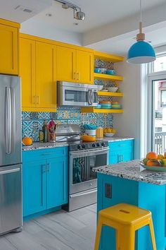 a kitchen with yellow and blue cabinets, stainless steel appliances and stools in it