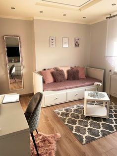 a living room filled with furniture and a mirror