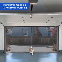 a dog is hanging upside down from the ceiling in an open garage with its head sticking out