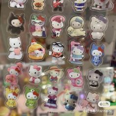 a bunch of hello kitty stickers in a display case