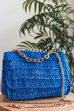 The Laura Flap bag is the perfect crossbody bag to take with you on all your adventures! Crafted from inviting woven straw, it's adorned with a touch of luxe from gold hardware and an adjustable chain strap. Open it up to find a fabric-lined interior, complete with one zipper pocket for extra security and one slip pocket for quick access to the essentials. Take Laura along on date night or when you need a roomy companion during errands - she's sure to be your new favorite accessory! Item Type: C Chic Blue Shoulder Bag With Braided Handles, Rectangular Straw Bag With Chain Strap For Vacation, Travel Shoulder Bag In Straw With Gold-tone Hardware, Straw Bag With Gold-tone Hardware For Travel, Summer Straw Bag With Chain Strap, Summer Rectangular Straw Bag With Chain Strap, Spring Vacation Shoulder Bag With Chain Strap, Summer Beach Shoulder Bag With Chain Strap, Beach Shoulder Bag With Chain Strap For Summer