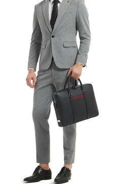 Compact and distinctive, this briefcase crafted from textured leather keeps your smartphone, laptop and other business essentials organized and easy to access. A detachable shoulder strap allows for hands-free carrying on your commute or between meetings. 16.3"W x 11.6"H x 2.6"D Lined Fits most 16" laptops Structured silhouette with flat base for stability Water-resistant Leather Imported Business Essentials, Leather Briefcase, 6 D, Hands Free, Manhattan, Carry On, Shoulder Strap, Smartphone, Water Resistant