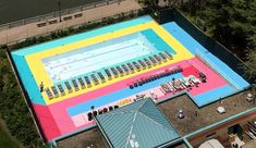 an aerial view of a swimming pool in the city