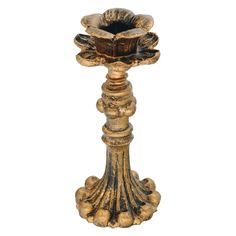 an ornately decorated candle holder on a white background