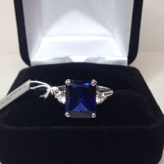 Beautiful Sapphire & Moissanite Diamond Ring * 4.5ct Emerald Cut Blue Sapphire measures 10mm x 8mm * 3mm Brilliant Cut Moissanite Diamond Accents (DEF VVS) * 5cts Total weight * 10k Yellow or White Gold - Select your Gold Color * Sized to order - Select your size Hallmarked & Gift Ready! Matching Earrings & Ring Also Available!   These Sapphires are Laboratory Grown & are identical to natural in every way, including Chemistry, Composition & Hardness with Excellent Clarity & Color Refraction.   T Emerald Cut Sapphire Ring, Gold Jewelry Gift, White Sapphire Ring, Moissanite Diamond Rings, Fine Art Jewelry, Sapphire Necklace, Sapphire Earrings, Blue Sapphire Rings, Elegant Ring