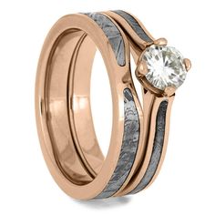 a rose gold wedding ring set with a white diamond in the center and an antelope band