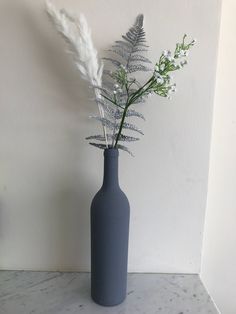 5 pieces of artificial arrangement.  2 pieces pampas grass  I piece silver fern 1 piece gypsophila Suitable for slim vase and bottles.  Makes a lovely display in the painted bottles. Slim Vase, Painted Bottles, Silver Fern, Artificial Flower Arrangements, Bottle Painting, Pampas Grass, Artificial Flowers, Flower Arrangements, 1 Piece