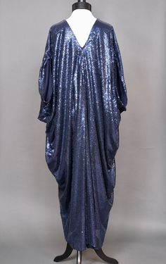 This iconic sequined caftan dress was made with a deep midnight blue soft mesh sequin fabric, and lined with a matching stretch lining. Sequin Kaftan Dress, Embellished Blue Kaftan For Party, Elegant Sequined Kaftan For Evening, Elegant Evening Kaftan With Sequins, Blue Sequin Dress For Festive Occasions, Blue Sequined Kaftan For Festive Occasions, Blue Embellished Kaftan For Party, Festive Sequined Party Kaftan, Festive Blue Sequin Dress