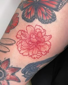 a woman's arm with butterflies and flowers on it