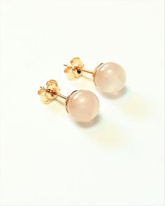 These stud earrings are solid 9ct gold with round pink Rose Quartz gemstones and 9ct gold earring backs. Each Rose Quartz ball measures approximately 6mm / 0.23" diameter.Small, delicate earrings, these studs are very pretty, with the palest pink stones. Each ball is smooth to the touch. Beautifully complimented by the solid gold ear posts and backs. An ideal gift for a loved one; Rose Quartz is known as the 'love stone'.6mm diameter stones.Please take a look at our jewellery section:https://www Classic Pink Hallmarked Earrings, Rose Gold Round Pierced Earrings, Classic Rose Gold Gemstone Earrings, Hypoallergenic Round Pink Gold Earrings, Hypoallergenic Pink Gold Round Earrings, Hypoallergenic Rose Gold Round Earrings, Rose Gold Birthstone Round Earrings, Rose Gold Birthstone Earrings, Rose Gold Round Birthstone Earrings