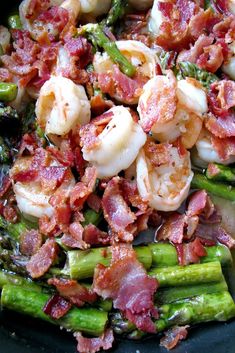 asparagus and shrimp with bacon in a skillet