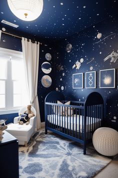 a baby's room with blue walls and space themed wallpaper, including a crib