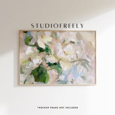 a painting hanging on the wall next to a vase with flowers in it that reads studiofreely