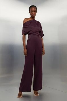 Viscose Satin Back Crepe Off Shoulder Jumpsuit | Karen Millen Chic Satin Jumpsuits And Rompers In Solid Color, Chic Solid Color Satin Jumpsuits And Rompers, Elegant Satin Jumpsuit Or Romper In Solid Color, Solid Satin Jumpsuits And Rompers For Night Out, Chic Formal Satin Jumpsuits And Rompers, Elegant One-shoulder Jumpsuits For Date Night, Elegant One-shoulder Jumpsuits And Rompers For Date Night, Elegant Jumpsuits And Rompers For Gala Party Season, Fitted Satin Jumpsuit And Romper For Party