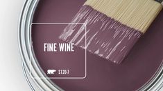 a paint can with a brush in it that says fine wine