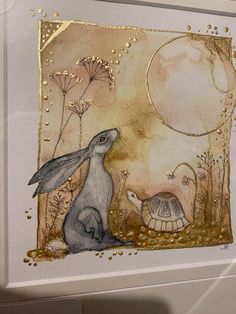 a card with an image of a rabbit and turtle