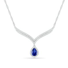 Elevate your evening attire effortlessly with this timeless fashion necklace. Crafted in sterling silver, this 1.5-inch design showcases a 7.0 x 5.0mm pear-shaped lab-created bright blue sapphire wrapped in a lab-created shimmering white sapphire halo. Additional created white sapphires adorn the double row chevron frame. Polished to a bright shine, this look suspends centered along a 16.5-inch rope chain that secures with a spring-ring clasp. Peoples Jewellers, Chevron Design, Teardrop Necklace, Evening Attire, White Sapphire, Rope Chain, Bright Blue, Spring Rings, Pear Shaped