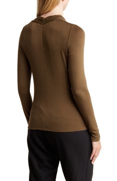 Refresh your wardrobe with this draped mock-neck top cut from a soft, lightweight knit with an easy back-zip closure. 23" length (size Small) Back zip closure Mock neck Long sleeves 98% rayon, 2% spandex Machine wash, dry flat Imported Model stats: 5'10" height, 32" bust, 25" waist, 36" hip. Model is wearing size Small. Versatile Long Sleeve Mock Neck Top, Versatile Fitted Mock Neck Long Sleeve Top, Moisture-wicking Nylon Tops With Medium Support, Brown Seamless V-neck Top, Stretch V-neck Brown Tank Top, Mock Neck Long Sleeve, Mock Neck Top, Lightweight Knit, Long Sleeve Top