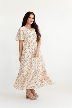 Description Features V-Neck Unlined short bell sleeve Elastic waist Single tiered skirt Delicate floral print Body and skirt lined Dress and lining 100% polyester Size + Fit Small 0-4, Medium 4-8, Large 8-12, 1X 12-16, 2X 16-20, 3X 20-24 Kristin is 5'4" a size 3 and is wearing a small Victoria is 5'6" a size 18 and is wearing a size 2X Runs true to size Ditsy Floral Print Flutter Sleeve Dress For Brunch, Flowy Tiered Ditsy Floral Dress, Flowy Tiered Ditsy Floral Print Dress, Flowy Tiered Floral Dress With Ditsy Print, Flowy Floral Dress With Ruffle Hem And Tiered Skirt, Flowy Tiered Floral Dress For Brunch, Flowy Floral Tiered Skirt Dress For Brunch, Modest Short Sleeve Floral Dress With Ditsy Print, Modest Midi Dress With Floral Print And Flutter Sleeves