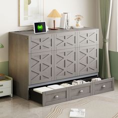 a gray cabinet with drawers in a living room