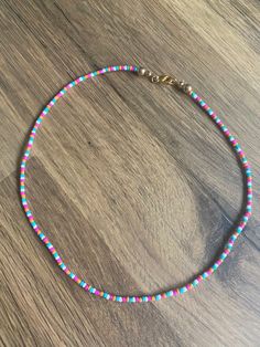 summer-Squad necklace  with white, blue and orange seed beads closed with clips!