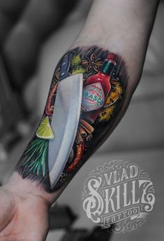 a man with a tattoo on his arm holding a knife and some condiments