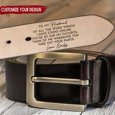 a leather belt with an engraved quote on it