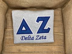 delta zeta patch on the back of a chair with burlocked fabric