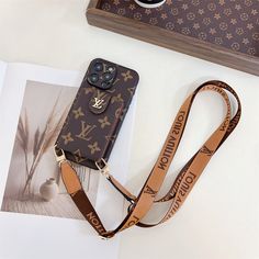 Signature Monogram Canvas: The LV iPhone case showcases the iconic Louis Vuitton monogram canvas, offering a timeless and sophisticated look. The monogram pattern not only enhances the aesthetic appeal but also signifies luxury and high fashion. Leather Button Card Holder: Featuring a secure button closure, the case includes a dedicated card holder to keep your essential cards safe and easily accessible. This functional design adds convenience by allowing you to carry your credit cards, IDs, or cash without needing a separate wallet. Crossbody Design: Equipped with a crossbody strap, the case provides hands-free convenience and style. The adjustable strap ensures a comfortable fit, making it perfect for on-the-go use, whether you're running errands or attending events. Premium Leather Cons Best Iphone Covers, Iphone Case Brands, Buy Louis Vuitton, Luxury Phone Case, Monogram Pattern, Lv Monogram, Iphone Screen, Button Cards, Card Bag