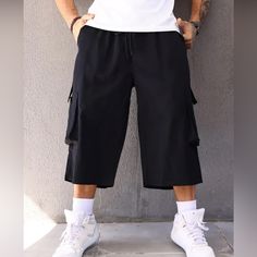 Plus Size Men's Solid Capri Cargo Pants For Outdoor Black Cargo Pants With Built-in Shorts For Outdoor, Casual Cargo Capri Pants With Pockets, Black Cargo Pants For Summer Outdoor Activities, Casual Capri Length Cargo Pants, Summer Black Cargo Pants For Outdoor Activities, Black Summer Cargo Pants For Outdoor Activities, Black Casual Cargo Pants With Built-in Shorts, Casual Bermuda Pants With Side Pockets, Black Relaxed Fit Capri Pants