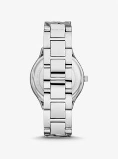 Our coveted Slim Runway watch is reimagined with modern glamour in mind. Designed with a sleek, minimalist dial, it features a curb-link bracelet strap as a luxe alternative to traditional center links. Stack it with complementing silver-tone jewelry for a major arm candy moment. Modern Silver Watches With Rectangular Dial, Modern Silver Watch With Rectangular Dial, Modern Metal Jewelry For Work, Modern Silver Watches With Subdials, Modern Business Watches With Stainless Steel Clasp, Modern Silver Watch Accessories, Modern Stainless Steel Watch Accessories With Polished Finish, Silver Watches With Metal Dial For Everyday Use, Modern White Gold Watch Accessories With Stainless Steel Clasp