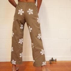 Our beloved Easy Sailor Pants have arrived with a flourish! These heavyweight canvas beauties offer a more structured design than our linen pants. Give your waist and hips a snug fit, while still having the space for the must-haves in the two roomy pockets! The sweet block-printed flowers add a cheerful finishing touch! Though we try to keep a small stock, often times garments are sewn to order. Please expect a ship date of up to 4 weeks from your order date. PRODUCT DETAILS 100% deadstock cotto Block Print Pants, Cotton Bottoms With Floral Print, Cotton Straight Leg Bottoms With Floral Print, Straight Leg Cotton Bottoms With Floral Print, Cotton Bottoms With Floral Print For Loungewear, Floral Print Cotton Pants, Cotton Wide-leg Pants With Floral Print, High-waisted Floral Print Cotton Pants, Floral Print High-waisted Cotton Pants