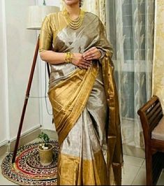 Step into the realm of timeless elegance with our Golden Grayish Silk Saree, meticulously handwoven in pure silk Chanderi. Each thread tells a tale of artisanal dedication, as skilled hands craft this masterpiece over months, ensuring every detail exudes unparalleled beauty. Paired with a plain unstitched raw silk blouse, available in a spectrum of colors to complement your style. Elevate your ensemble with the option of custom blouse stitching, adding a bespoke touch to your impeccable attire. 🌟 Don't just wear a saree; own the spotlight with Poonam Sarees! 💫🛍️ Fabric: Pure Silk Colour: Same as picture Work: Handwoven Chanderi Wash Care: Dry Clean NOTE: Expect minor variations due to lighting or monitor settings. Our products are handmade, and we do not offer return, refund, cancellati Deepika Padukone Sari, Deepika Padukone Latest, Gold Silk Saree, Hands Craft, Raw Silk Blouse, Kora Silk Sarees, Blouse Stitching, Chanderi Silk Saree, Saree Trends