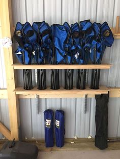 there are many blue umbrellas on the shelf