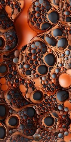 an abstract pattern made up of circles and holes in brown, black and orange colors