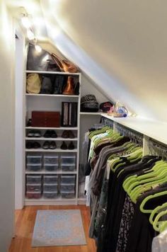 an image of a closet with clothes on it