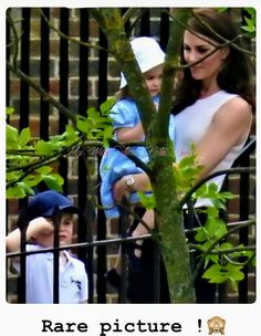 the duke and princess of cambridge with their son prince george, who is wearing a chef's hat