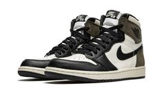 The Air Jordan 1 “Dark Mocha” progresses the timeless silhouette’s association with wearable earth tones.  Inspiration for the “Dark Mocha,” a Fall 2020 release, is culled from one of the most popular sneaker collaborations of 2019—Travis Scott’s Air Jordan 1 collection.  Though unlike the rapper’s take on the Jordan 1, this “Dark Mocha” iteration features smooth black leather overlays on the forefoot, eyelets, and toe cap.  White leather appears on the mid-panel, collar, and perforated toe.  Classic black leather Swoosh branding dots the mid-panel and a black “Wings” logo is placed on the brown suede collar.  Additional brown suede detailing is located on the heel.  A white nylon tongue, black cotton laces, and black “Nike Air” on the tongue tab finish off yet another desirable signature Jordan 1 Dark Mocha, Jordan 1 Mocha, Nike Essentials, Popular Sneakers, Jordan 1 High Og, Jordan Sneakers, Nike Dunk High, Air Jordan 1 Retro High Og, Air Jordan 1 Retro High