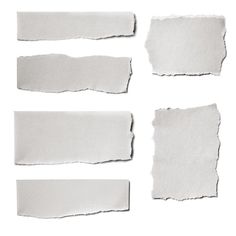 four pieces of torn white paper on a white background