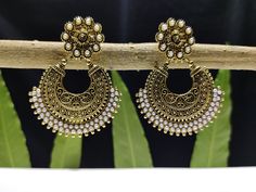 "This Pretty Traditional Pair of Earrings in gold plated Alloy Material. Design: Floral Pattern ( Oxidized ) Color- copper Gold. Material-Metal/Alloy Size: 5.5 Centimeter Long X 4 Centimeter Wide ( approx.). Obsessed with Indian Jewelry! This is traditional gold-tone jewelry which is carved from our Indian artist. This jewelry are great touch on your collection.  Color may be difference because in few cases color may be different from monitor setting. About Us:  Being of Indian background, has a Ornate Gold Dual-tone Earrings, Gold Dual-tone Chandbalis For Celebration, Gold Dual-tone Chandbalis For Festivals, Ornate Dual-tone Gold Earrings, Dual-tone Gold Chandbalis For Festivals, Gold Dual-tone Danglers For Festive Occasions, Gold Dual-tone Chandbali Earrings, Gold Earrings With Oxidized Finish For Festive Occasion, Festive Gold Earrings With Oxidized Finish