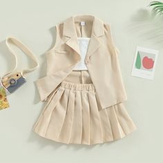 Dress your little girl in chic style with our Sleeveless Vest Coat and Pleated Skirt Outfit! This adorable ensemble is perfect for any occasion, blending elegance and comfort for your toddler's wardrobe. This stylish outfit features a sleek sleeveless vest coat paired with a charming short pleated skirt. Designed for toddlers and infants, this clothing suit ensures your little one looks fashionable at all times. The vest coat offers a smart, tailored look, while the pleated skirt adds a playful touch, perfect for kids who love to twirl and have fun. Picture your little girl turning heads at a party, family gathering, or during a casual day out in this sophisticated yet kid-friendly outfit. The comfortable fit allows for all-day wear, while the fashionable design makes it a favorite choice Coat And Skirt Outfit, Coat And Skirt, Short Pleated Skirt, Pleated Skirt Outfit, Pleated Skirt Short, Vest Coat, Girls Summer Outfits, Stylish Outfit, Sleeveless Jacket