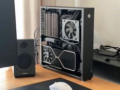 a computer case sitting on top of a wooden desk