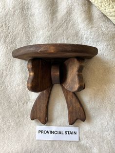 a piece of wood that has been carved into the shape of a man's head