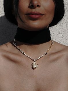 B A R O Q U E ∙ P E A R L ∙ C H O K E R ∙ N E C K L A C E This beautiful gold and silver choker features a baroque pearl that is reversible and has 18k Gold accents. The choker is adjustable from 16 to 20 inches to fit perfectly to your needs, and is sure to turn heads wherever you go. * Material: High Quality Solid 925 Sterling Silver- Hypo-Allergenic and Nickel Free * Finish: Sterling Silver | 18K Gold Accents. * Featuring a natural baroque pearl, irregular and beautiful just as nature intende Gold Necklaces With Sterling Silver Clasp, White Sterling Silver Jewelry With Detachable Pendant, Gold Colored Sterling Silver Fusion Necklaces, Silver Fusion Jewelry With Pearl Pendant, Diy Jewelry Necklace, Necklace Design, Silver Choker, Wedding Jewellery Necklace, Jewelry Boxes