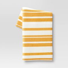 an orange and white striped dish towel