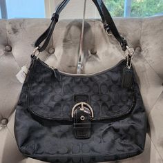 Nwt Coach Soho Signature Black/Silver Flap Duffle Bag 23164e Never Used, Tags Still Attached. Great Gift For A Birthday, Anniversary Or Mothers Day. I Will Include A Dust Cover, If You Don't Ask Me To Drop My Price. Perfect For That Fashionista Or Timeless Zipper At The Top With Coach Hang Tag, Adjustable Strap, Can Be Longer Or A Shoulder Bag. Front Flap With Pocket - 2 Interior Wall Pockets Without Zipper- 1 Interior Wall Pocket With Zipper - Purple Lining Bag Height: 9.5" Bag Length: 13.25" B Silver Hobo Bag With Silver-tone Hardware Tote, Silver Hobo Bag With Silver-tone Hardware, Silver Hobo Bag With Silver-tone Hardware For Evening, Classic Black Hobo Bag With Silver-tone Hardware, Silver Hobo Bag With Silver-tone Hardware For Everyday, Everyday Silver Hobo Bag With Silver-tone Hardware, Formal Black Hobo Bag With Silver-tone Hardware, Elegant Silver Hobo Bag With Silver-tone Hardware, Elegant Silver Hobo Bag For Travel