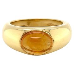 This lovely authentic ring is from Tiffany & Co; it is crafted from 18k yellow gold featuring a tapered dome shape ring with a polished finish. The top center has a beautiful oval cabochon orange citrine gemstone. The ring is signed by the designer with the gold content. Brand: Tiffany & Co. Hallmark: Tiffany & Co. 750 Italy Gemstone: citrine 9mm long x 6.5mm wide Material: 18k yellow gold Measurement: 8mm wide x 6mm high Ring size: 5 Weight: 8 grams Citrine Engagement Ring, Gold Dome Ring, Citrine Ring Engagement, Ring Rosegold, Louis Comfort Tiffany, Dome Ring, Elsa Peretti, Tiffany And Co, Citrine Gemstone